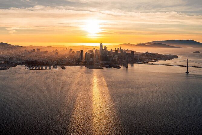Airplane San Francisco Sunset Flight Tour - Oakland skyline to the Bay Bridge: your first aerial “wow”